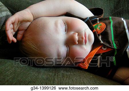 Stock Photograph - Slumber boy. Fotosearch