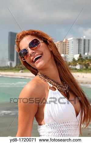 Smailing young woman in Miami Beach, Florida View Large Photo Image Stock Image - Smailing young woman in Miami Beach, Florida. Fotosearch