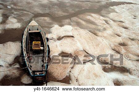Small boat embedded in ice - Bourcefranc le Chapus - Charentes maritimes - France View Large Photo Image Picture - Small boat embedded in ice - Bourcefranc le Chapus - Charentes maritimes - France. Fotosearch