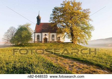 Small chapel on hill at foggy morning in spring. Franconia, Bavaria / Germany View Large Photo Image Stock Image - Small chapel on hill at foggy morning in spring. Franconia, Bavaria / Germany. Fotosearch