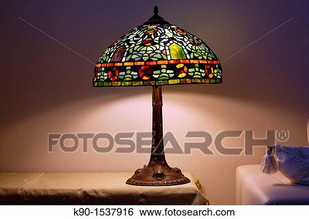 Small desk side lamp made of colorful glas, burning, Gabiano, Pimont, Italy, Europe View Large Photo Image Stock Photograph - Small desk side lamp made of colorful glas, burning, Gabiano, Pimont, Italy, Europe. Fotosearch
