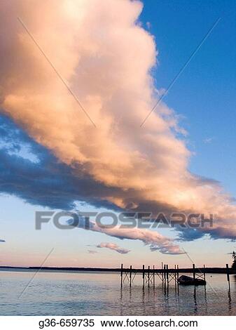 Small dock with boat at sunset in Sebago Lake, Maine View Large Photo Image Stock Photography - Small dock with boat at sunset in Sebago Lake, Maine. Fotosearch