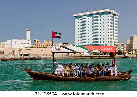 Small dow boats offer water taxi service along Dubai Creek in Dubai, UAE, Persian Gulf View Large Photo Image Stock Image - Small dow boats offer water taxi service along Dubai Creek in Dubai, UAE, Persian Gulf. Fotosearch