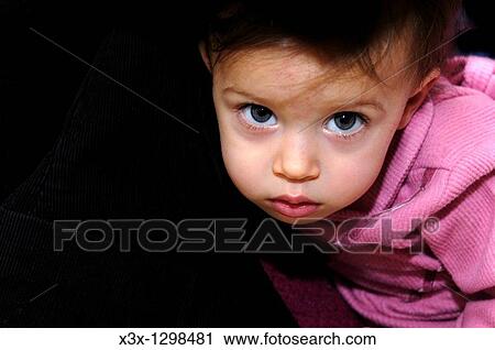 Small female child looking straight back View Large Photo Image Stock Image - Small female child looking straight back. Fotosearch