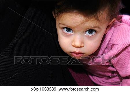 Small female child looking straight back View Large Photo Image Stock Photo - Small female child looking straight back. Fotosearch