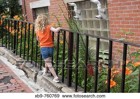 Small girl on a Portland, Maine street. View Large Photo Image Stock Photo - Small girl on a Portland, Maine street.. Fotosearch