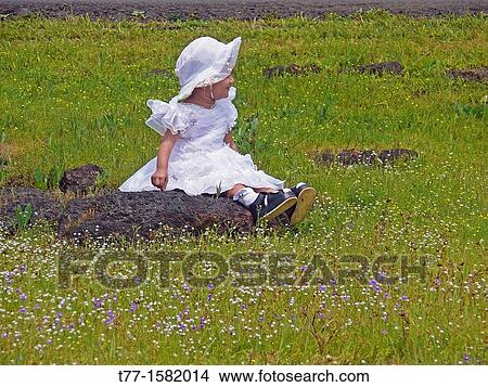 Small girl seating at green heaths, Plateau of flowers, Kaas, Satara, Maharashtra, India View Large Photo Image Picture - Small girl seating at green heaths, Plateau of flowers, Kaas, Satara, Maharashtra, India. Fotosearch