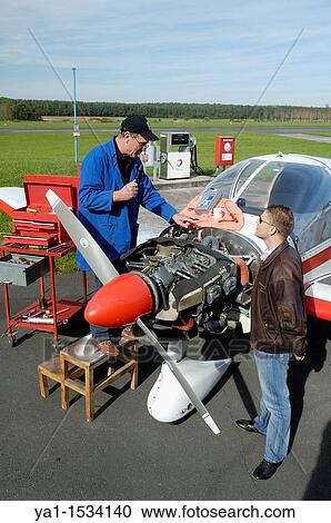 Small plane's mechanic talking with private pilot, France. The plane is a Robin DR-400 View Large Photo Image Stock Image - Small plane's mechanic talking with private pilot, France. The plane is a Robin DR-400. Fotosearch