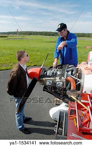 Small plane's mechanic talking with private pilot, France. The plane is a Robin DR-400 View Large Photo Image Stock Image - Small plane's mechanic talking with private pilot, France. The plane is a Robin DR-400. Fotosearch