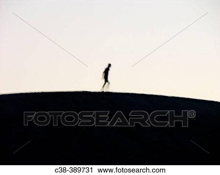 small planet, big man View Large Photo Image Stock Image - small planet, big man. Fotosearch
