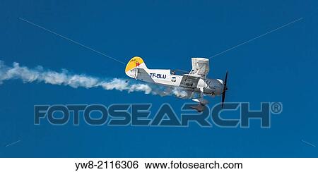 Stock Photograph - Small prop airplane performing tricks, Reykjavik, Iceland.. Fotosearch