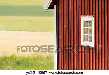 Small red wooden cottage with window overlooking field, Sweden. View Large Photo Image Stock Photo - Small red wooden cottage with window overlooking field, Sweden.. Fotosearch