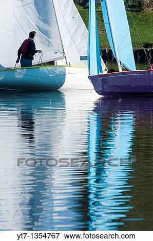 Stock Photo - Small sailing boats on the Arrow valley lake country park, Redditch, Worcestershire, West Midlands, England, UK. Fotosearch