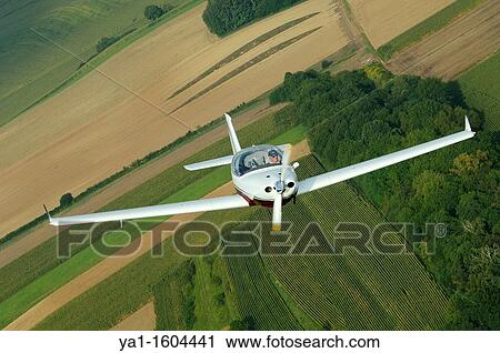 Small sport European LSA Aerospool Dynamic Turbo plane flying over France View Large Photo Image Stock Image - Small sport European LSA Aerospool Dynamic Turbo plane flying over France. Fotosearch