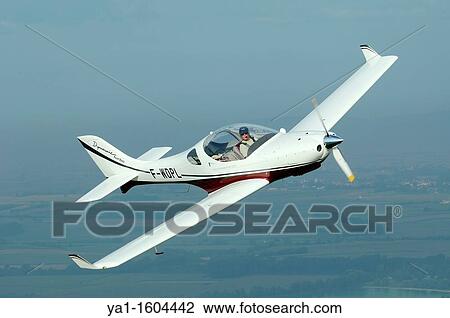 Small sport European LSA Aerospool Dynamic Turbo plane flying over France View Large Photo Image Stock Image - Small sport European LSA Aerospool Dynamic Turbo plane flying over France. Fotosearch