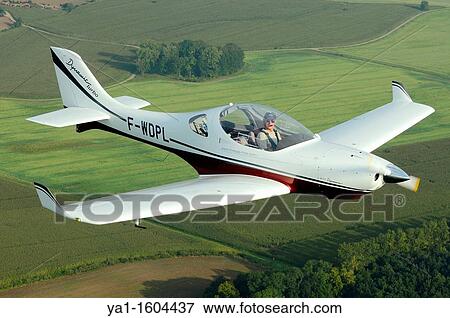 Small sport European LSA Aerospool Dynamic Turbo plane flying over France View Large Photo Image Stock Photo - Small sport European LSA Aerospool Dynamic Turbo plane flying over France. Fotosearch