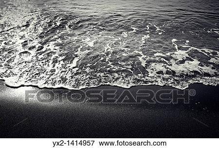 Small wave on the beach, Mataro, Catalonia, Spain View Large Photo Image Stock Photo - Small wave on the beach, Mataro, Catalonia, Spain. Fotosearch