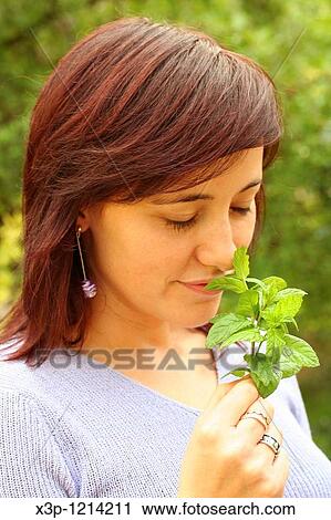 Smelling mint View Large Photo Image Stock Image - Smelling mint. Fotosearch