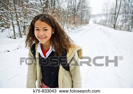 Smililng schoolgirl walking on country road View Large Photo Image Stock Image - Smililng schoolgirl walking on country road. Fotosearch