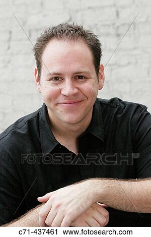 Stock Image - Smiling 30's caucasian man. Fotosearch