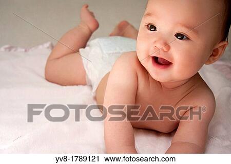 Smiling baby girl wearing a diaper View Large Photo Image Stock Image - Smiling baby girl wearing a diaper. Fotosearch