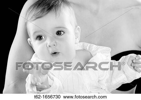 Smiling baby in the arms of his mother Foreground Black and White View Large Photo Image Stock Image - Smiling baby in the arms of his mother Foreground Black and White. Fotosearch