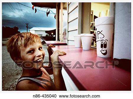 Smiling boy at ice cream stand. Indiana, USA View Large Photo Image Stock Image - Smiling boy at ice cream stand. Indiana, USA. Fotosearch