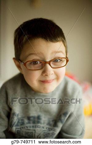 Smiling boy with eye glasses. View Large Photo Image Stock Image - Smiling boy with eye glasses.. Fotosearch