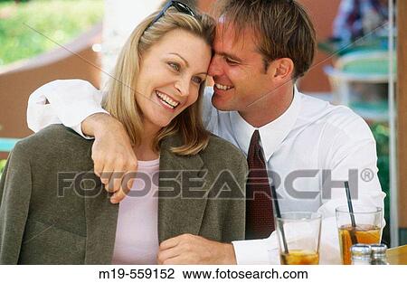 smiling couple at a cafe View Large Photo Image Stock Image - smiling couple at a cafe. Fotosearch