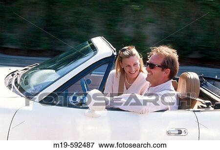 smiling couple in a convertible View Large Photo Image Stock Photo - smiling couple in a convertible. Fotosearch