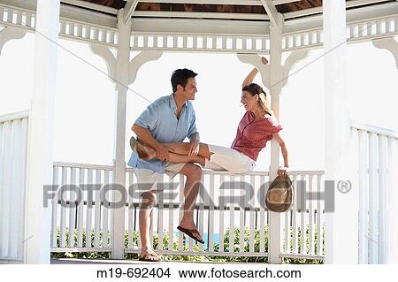 Smiling couple in a Gazebo View Large Photo Image Picture - Smiling couple in a Gazebo. Fotosearch
