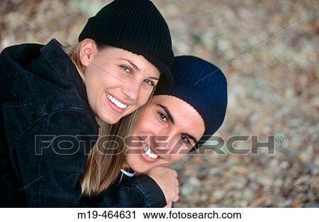 smiling couple in wool hats View Large Photo Image Stock Image - smiling couple in wool hats. Fotosearch