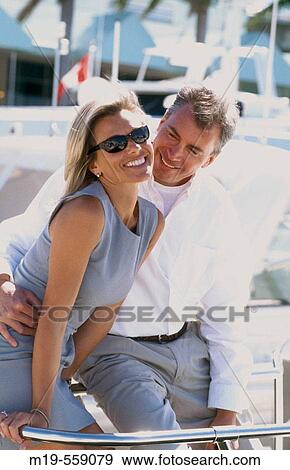 smiling couple on a yacht View Large Photo Image Stock Photo - smiling couple on a yacht. Fotosearch