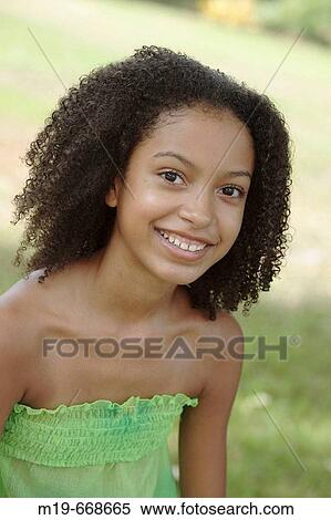 Stock Photography - Smiling ethnic girl. Fotosearch