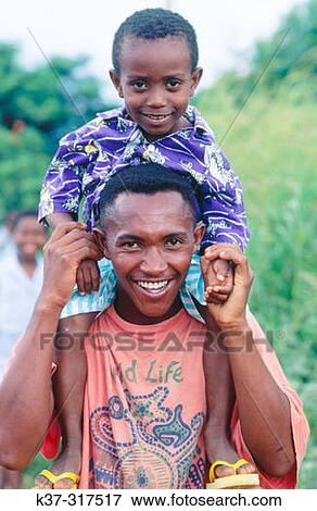Smiling father with son. Madagascar View Large Photo Image Stock Photo - Smiling father with son. Madagascar. Fotosearch