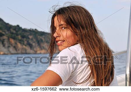 Smiling girl in a boat View Large Photo Image Stock Image - Smiling girl in a boat. Fotosearch