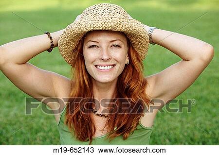 Smiling girl in a straw hat View Large Photo Image Stock Image - Smiling girl in a straw hat. Fotosearch
