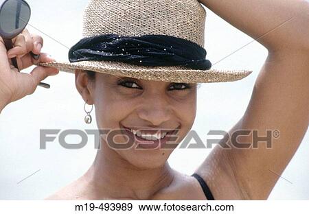 smiling girl in a straw hat View Large Photo Image Stock Photo - smiling girl in a straw hat. Fotosearch