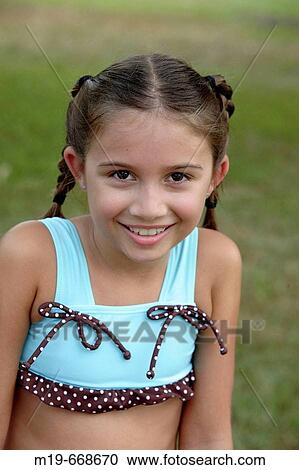 Smiling girl in pigtails View Large Photo Image Stock Image - Smiling girl in pigtails. Fotosearch