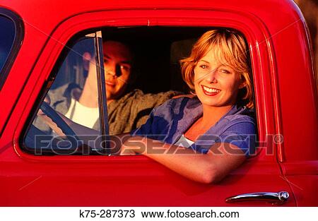 Smiling girl in red pick-up truck View Large Photo Image Stock Image - Smiling girl in red pick-up truck. Fotosearch
