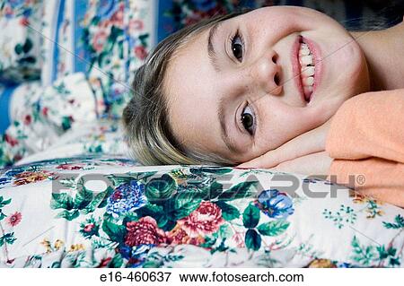 smiling girl on bed View Large Photo Image Stock Photo - smiling girl on bed. Fotosearch