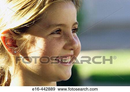 Stock Photo - Smiling girl. Fotosearch