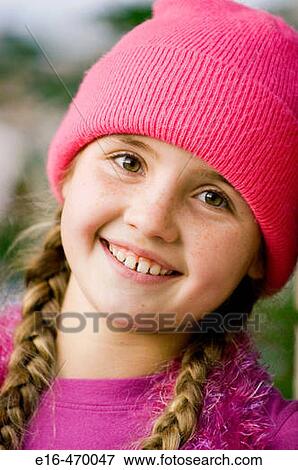 Smiling girl with cap View Large Photo Image Stock Photo - Smiling girl with cap. Fotosearch
