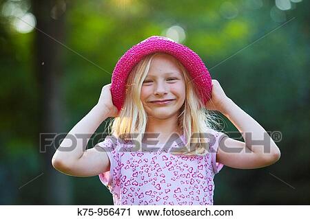 Smiling girl with hat View Large Photo Image Stock Image - Smiling girl with hat. Fotosearch