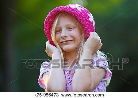 Smiling girl with hat View Large Photo Image Stock Image - Smiling girl with hat. Fotosearch