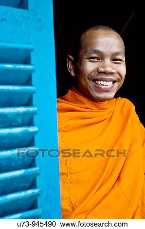 Stock Image - Smiling in the monastery.. Fotosearch