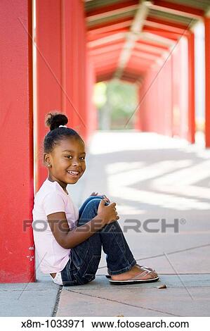 Smiling little black girl View Large Photo Image Stock Image - Smiling little black girl. Fotosearch