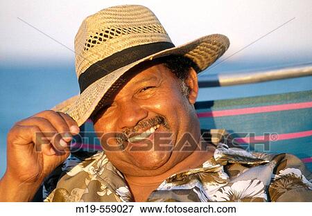 smiling man in a straw hat View Large Photo Image Stock Photo - smiling man in a straw hat. Fotosearch