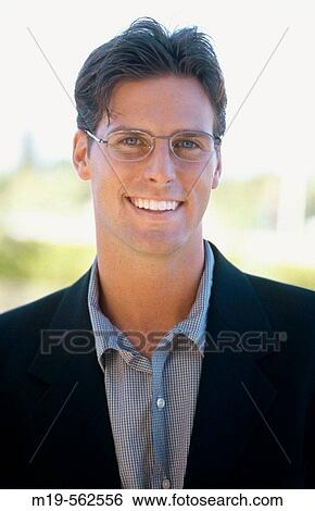smiling man in glasses View Large Photo Image Stock Photograph - smiling man in glasses. Fotosearch