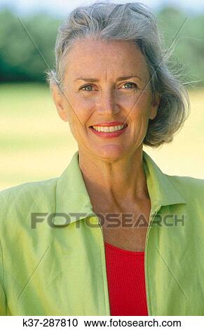 Stock Image - Smiling mature woman portrait. Fotosearch